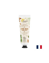 Crème à la main avec de l'huile d'amande sucrée, du beurre de karité, de l'aloe vera, 30 ml de nature floute